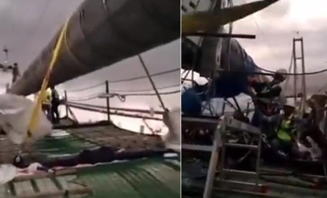 Köprü inşaatında çalışan işçiler, fırtınaya 300 metre yükseklikte yakalandı